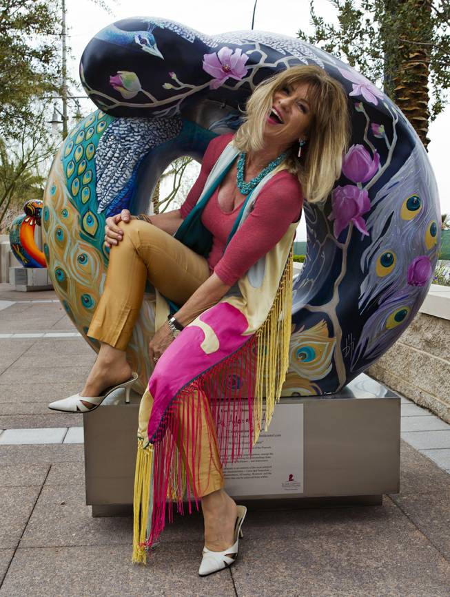 Artist Beti Kristof with her work "Wisdom-Beauty-Grace" joins others as the St. Jude Las Vegas Local Chapter unveils their new 2014 Sculpture Collection titled "Celebration of Life" at The Smith Center on Thursday, March 06, 2014.